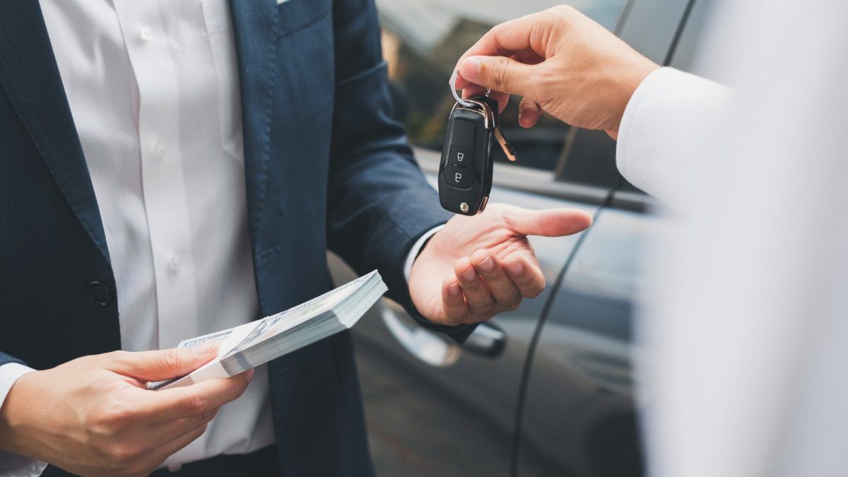 Giving a Car Key and Money for Buying a Car E1691608919497