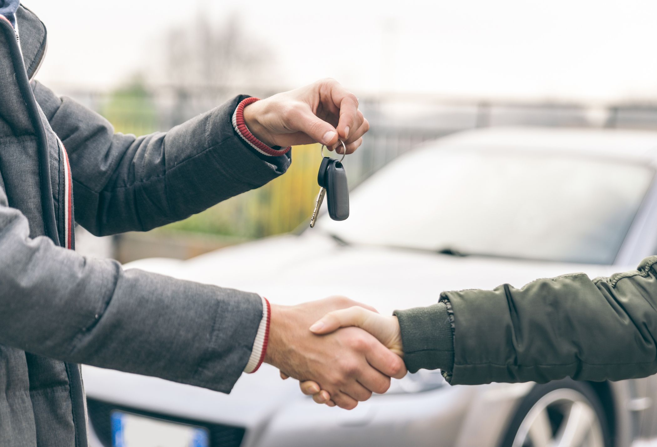 Two People Reaching an Agreement About a Car Sale Royalty Free Image 1665671206.jpg