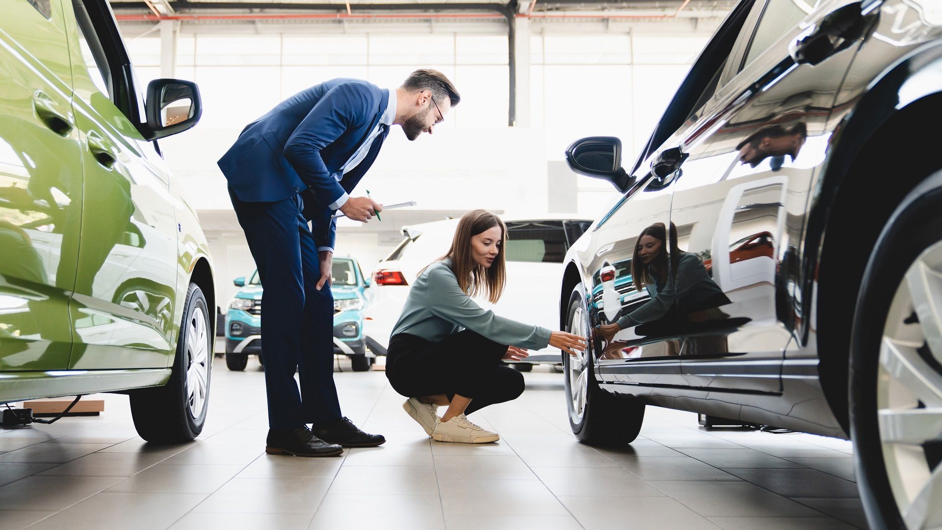 Young Woman Browses Cars Auto Dealership I Stock 1354041251