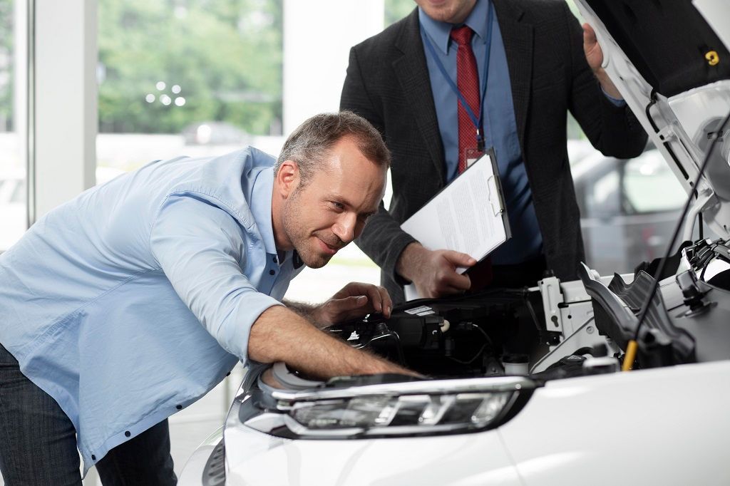 Close up Customer With Business Person Car Dealership